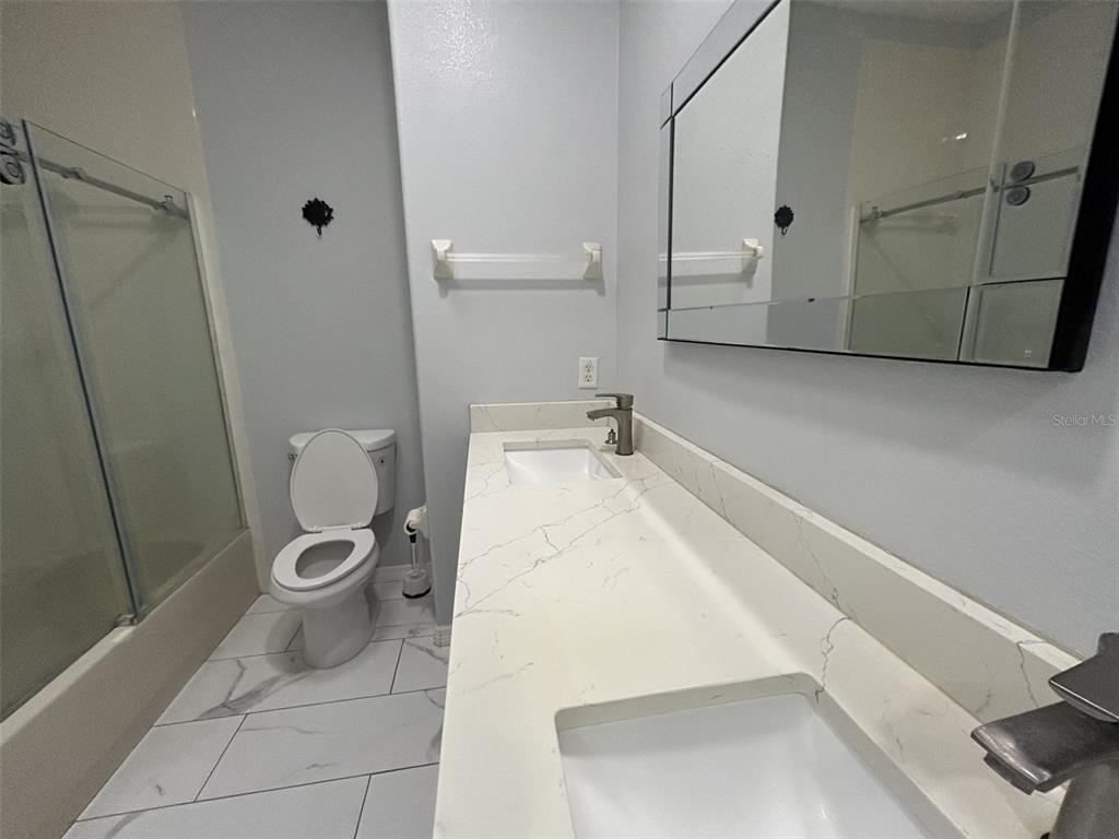 10439 Andover Point Circle Orlando, FL 32825 - Photo 29 of 33 a bathroom with a toilet and a sink