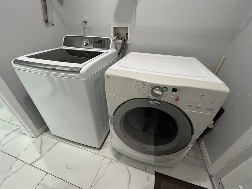 10439 Andover Point Circle Orlando, FL 32825 - Photo 32 of 33 a utility room with dryer and washer
