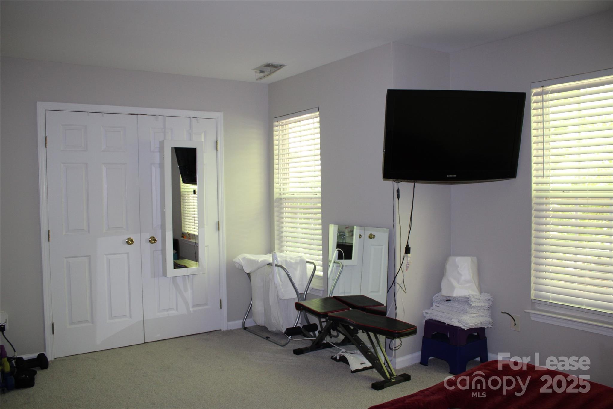 18630 Oakhurst Boulevard Cornelius, NC 28031 - Photo 15 of 20 a living room with furniture and a flat screen tv