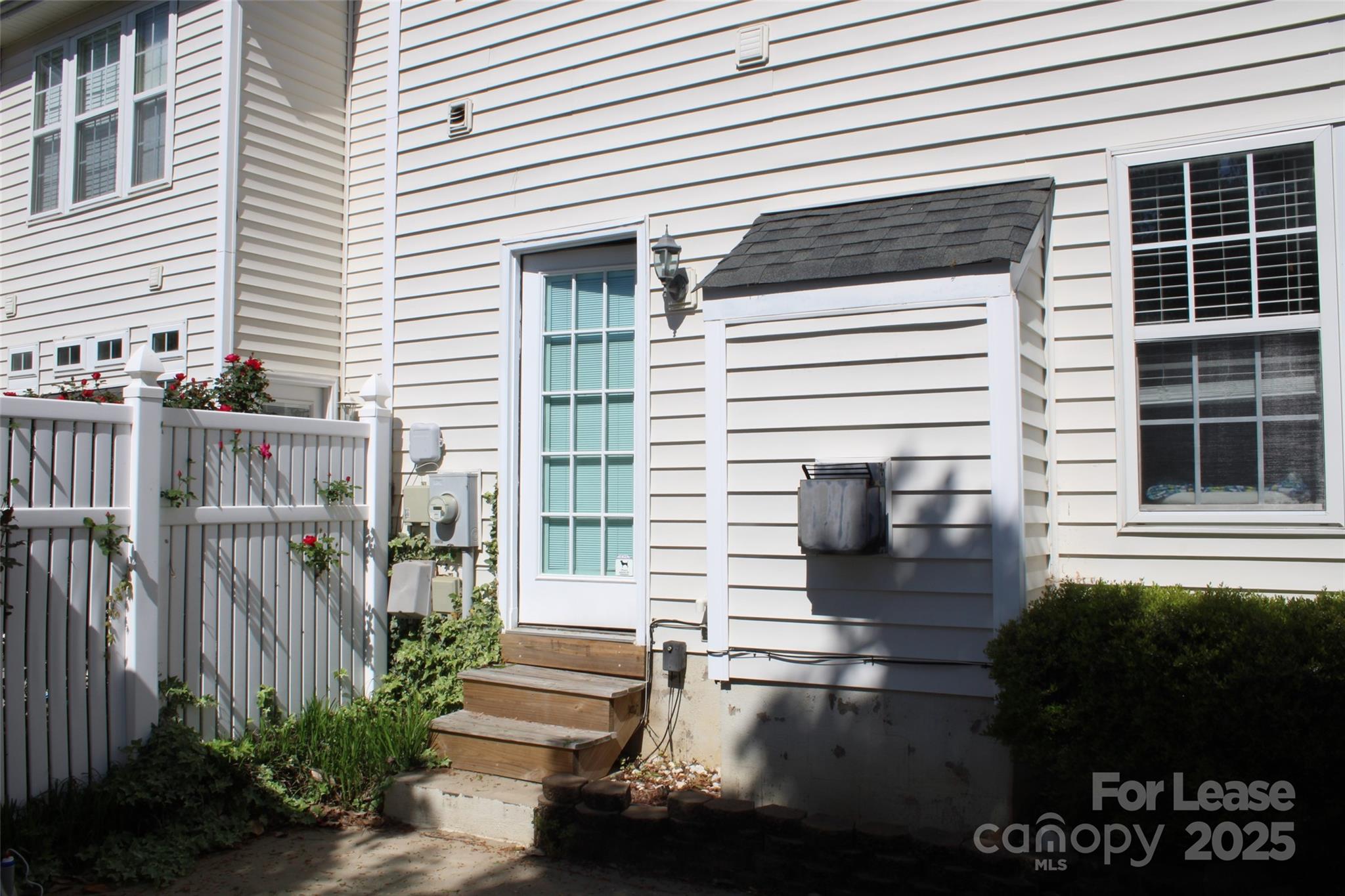 18630 Oakhurst Boulevard Cornelius, NC 28031 - Photo 19 of 20 a front view of a house with a yard