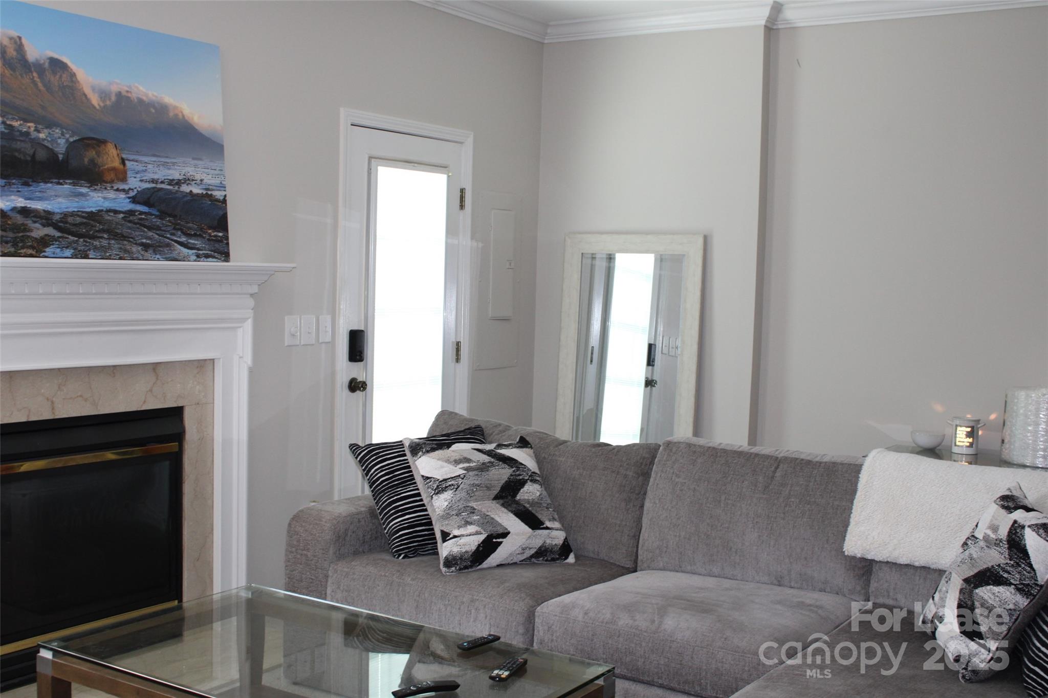 18630 Oakhurst Boulevard Cornelius, NC 28031 - Photo 7 of 20 a living room with furniture and a fireplace