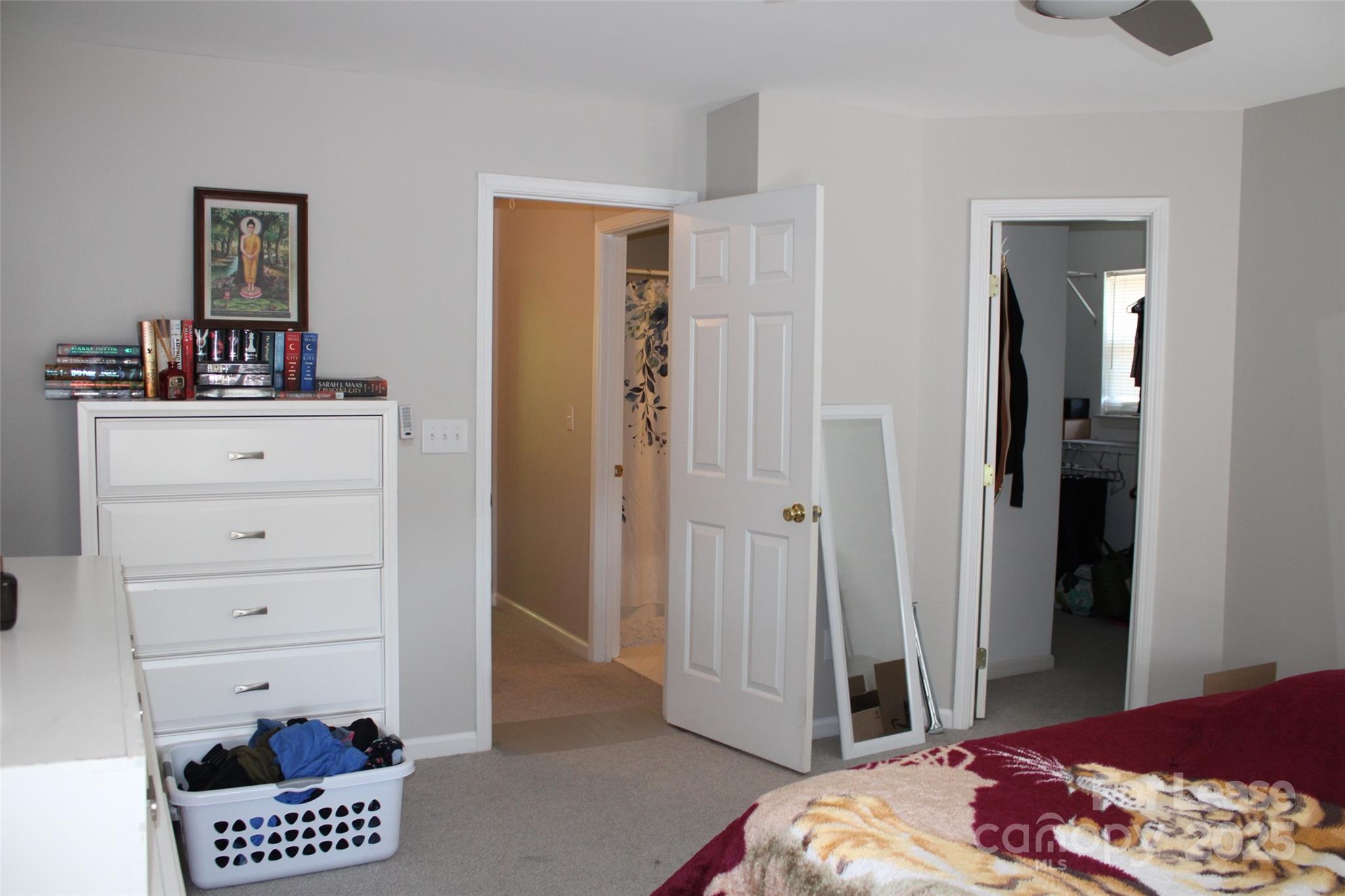 18630 Oakhurst Boulevard Cornelius, NC 28031 - Photo 10 of 20 a bedroom with a bed and a dresser