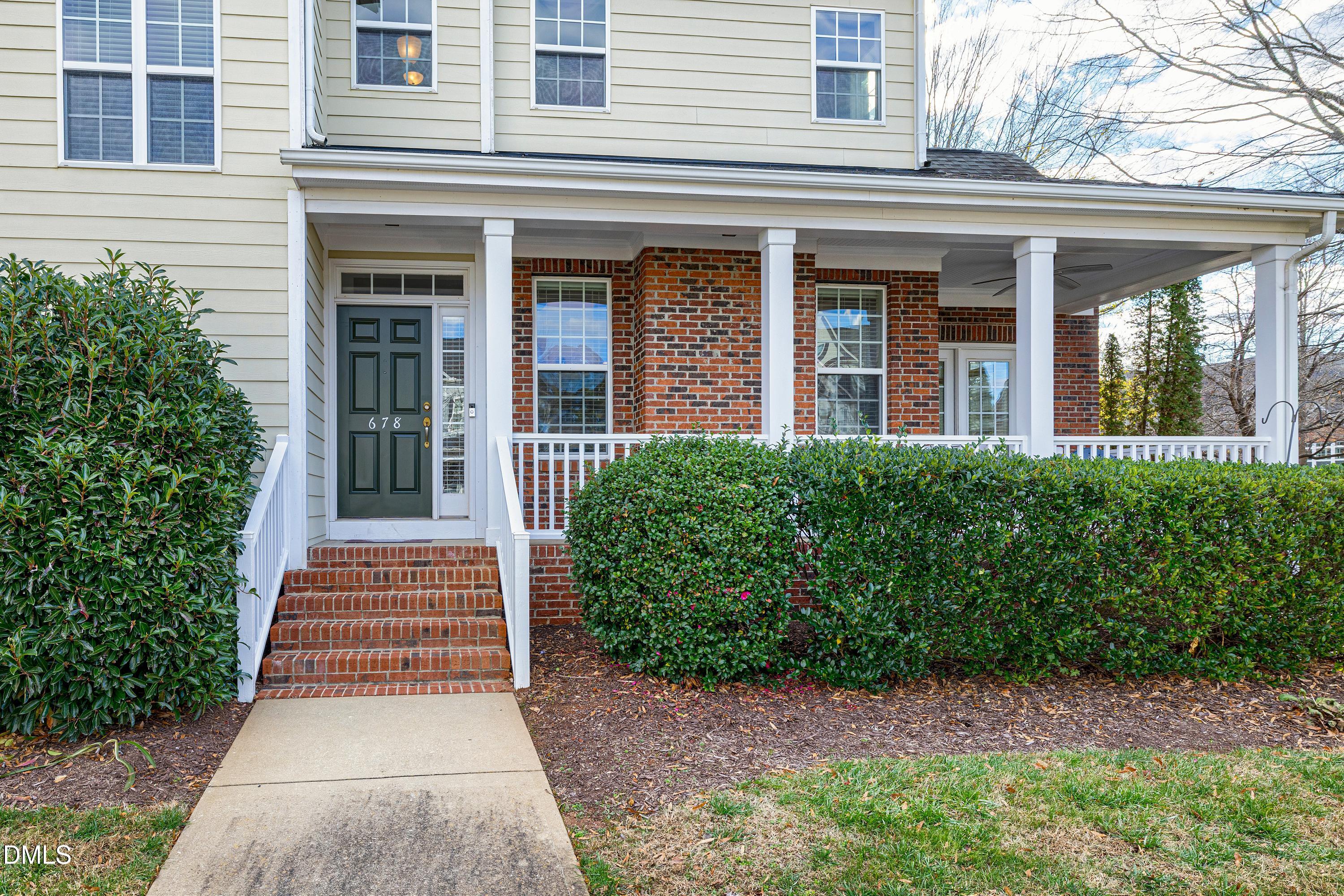 678 Democracy Street Raleigh, NC 27603 - Photo 4 of 67 a view of a house with potted plants