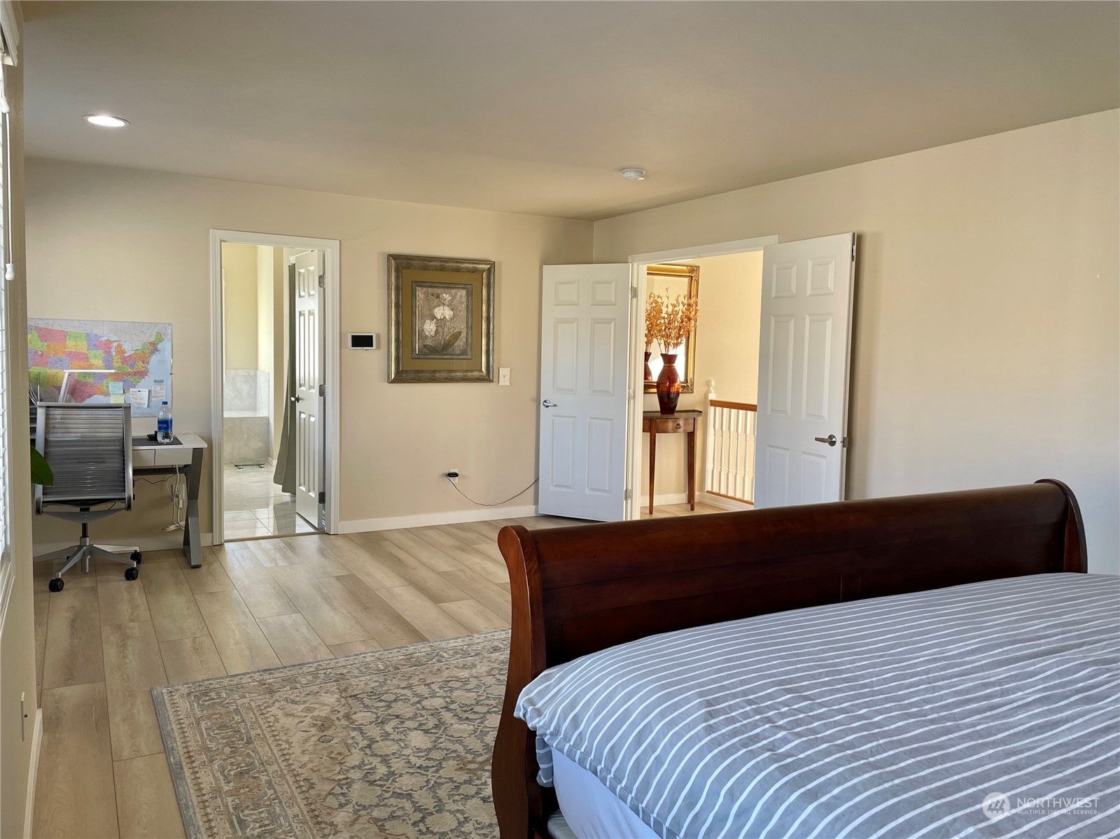 113 181st Street Southwest Bothell, WA 98012 - Photo 16 of 26 a bedroom with a bed and wooden floor