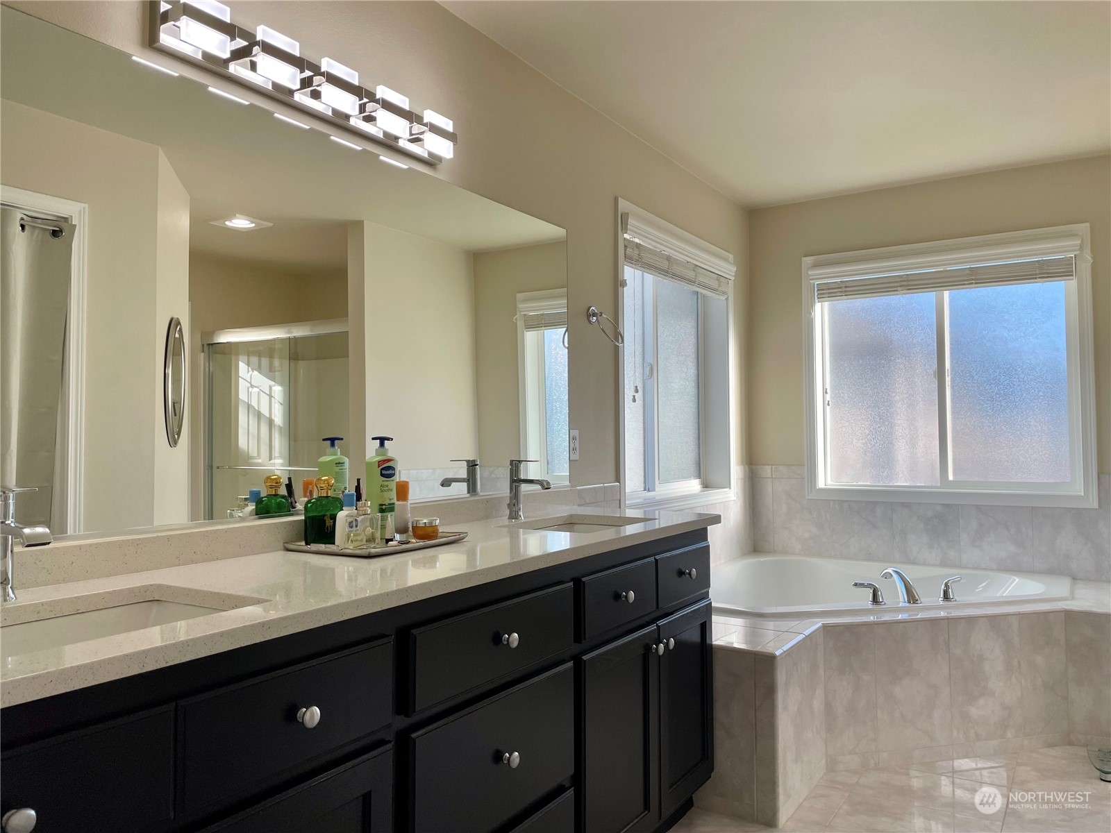 113 181st Street Southwest Bothell, WA 98012 - Photo 17 of 26 a bathroom with double vanity and a mirror