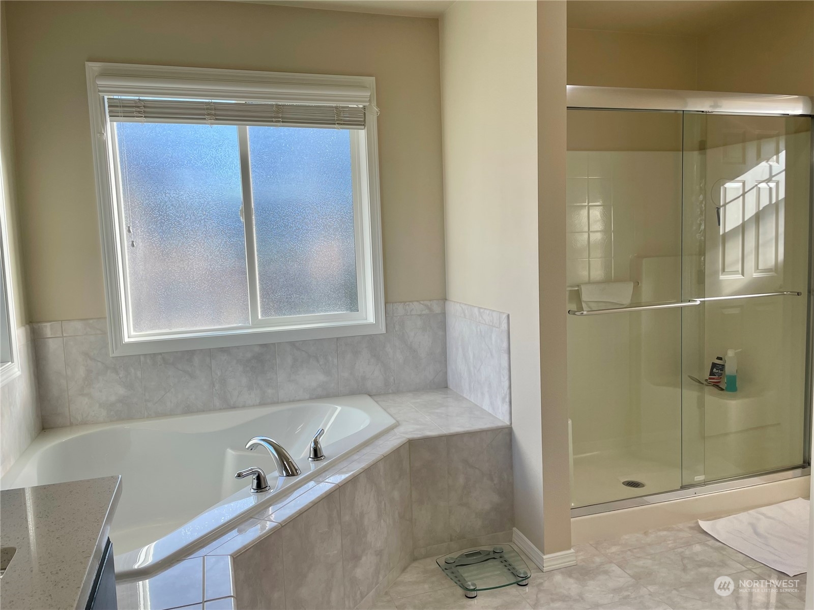 113 181st Street Southwest Bothell, WA 98012 - Photo 18 of 26 a bathroom with a tub and shower