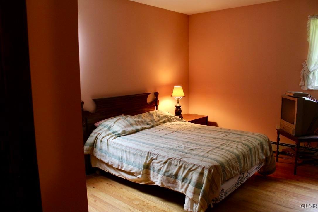 2765 Jackson Road Stroudsburg, PA 18360 - Photo 13 of 29 a bedroom with a bed and lamp