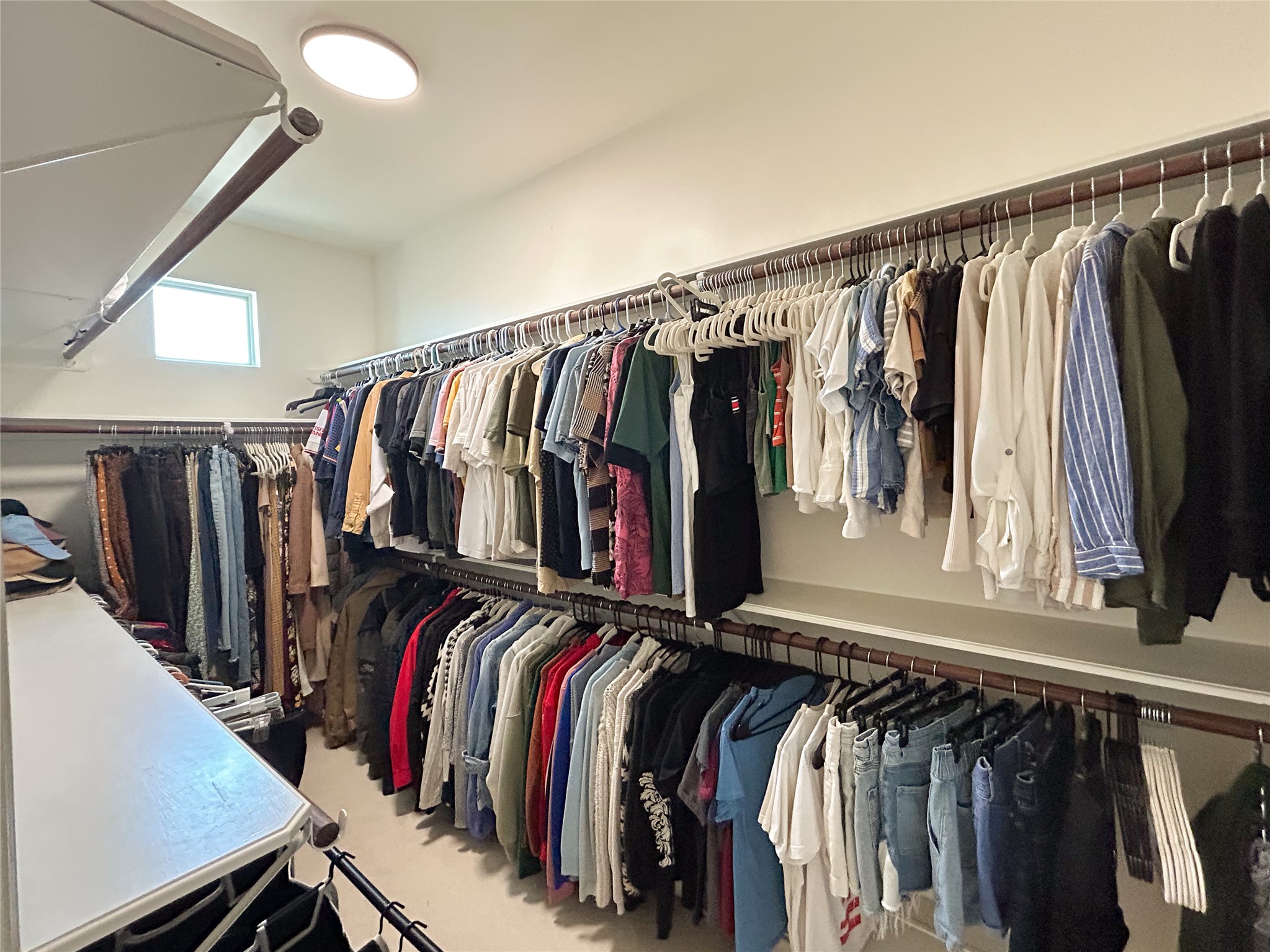 1128 West 26th Street Houston, TX 77008 - Photo 26 of 34 a view of walk in closet with clothes and shoes