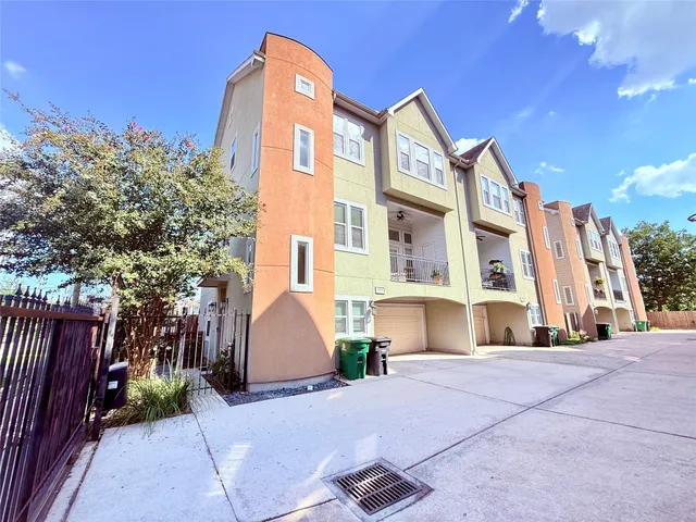 a view of a building with a yard