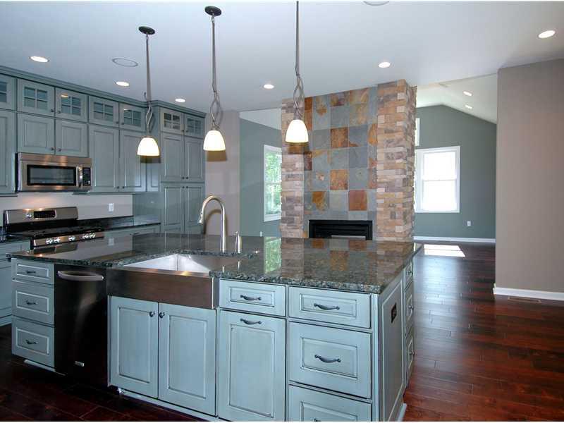 100 Granite Ridge Circle Mars, PA 16046 - Photo 3 of 25 Kitchen. Spacious kitchen island and stone/slate 2 sided fireplace