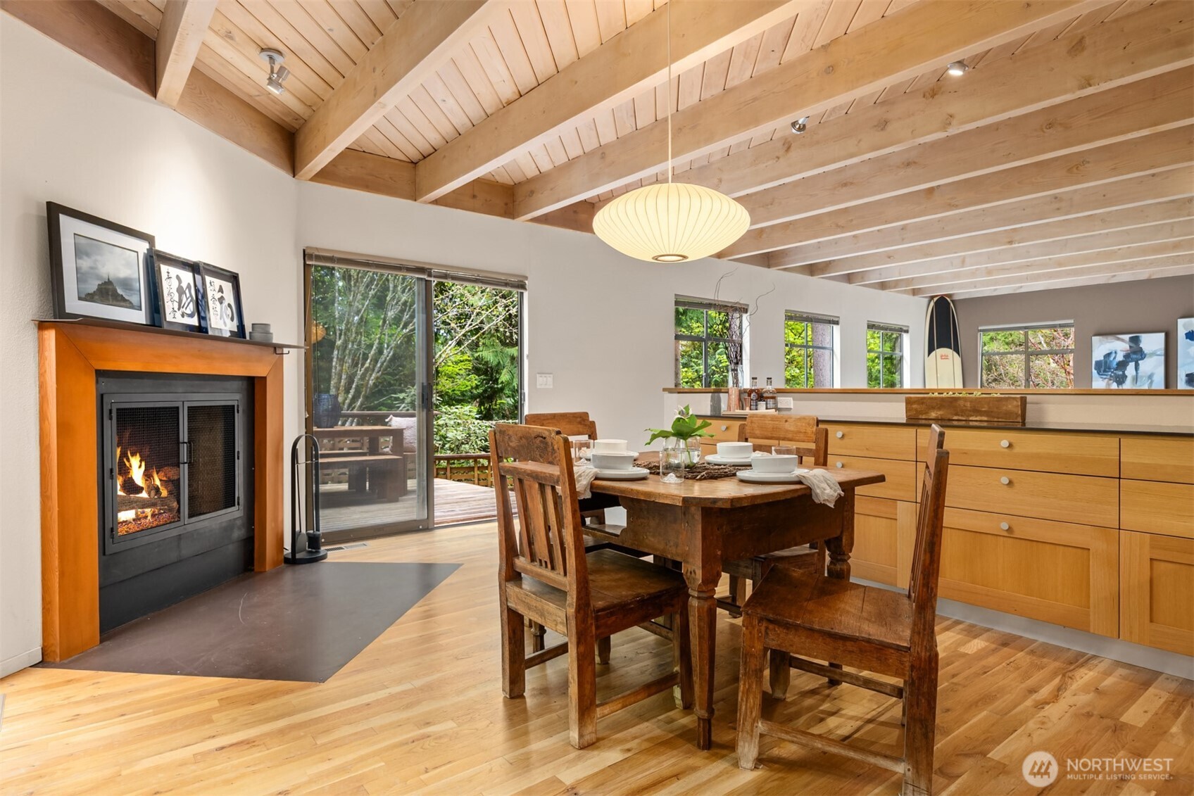 8151 Northeast Hidden Cove Road Bainbridge Island, WA 98110 - Photo 11 of 40 a view of a dining room with furniture window and outside view