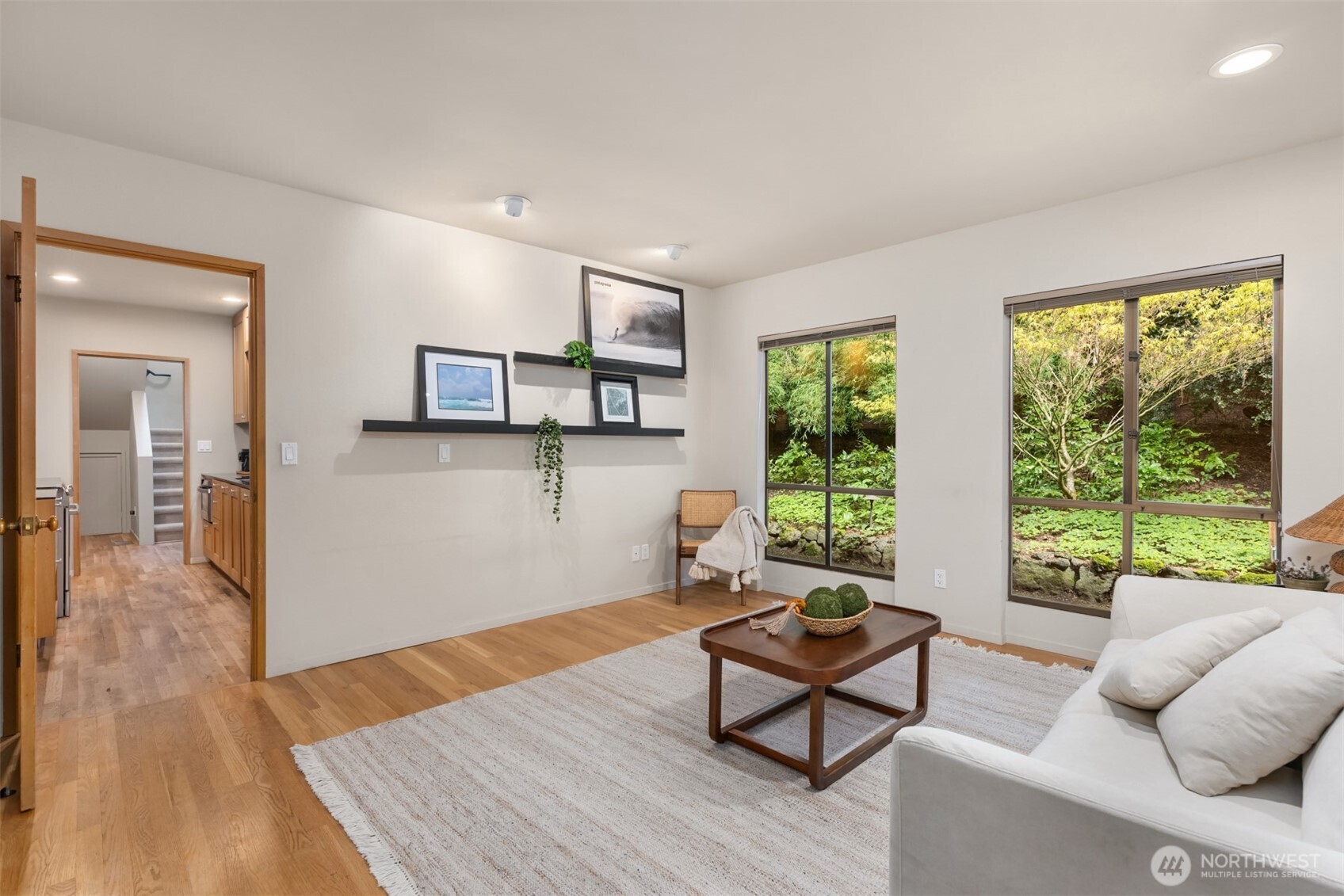 8151 Northeast Hidden Cove Road Bainbridge Island, WA 98110 - Photo 14 of 40 a living room with furniture and a window