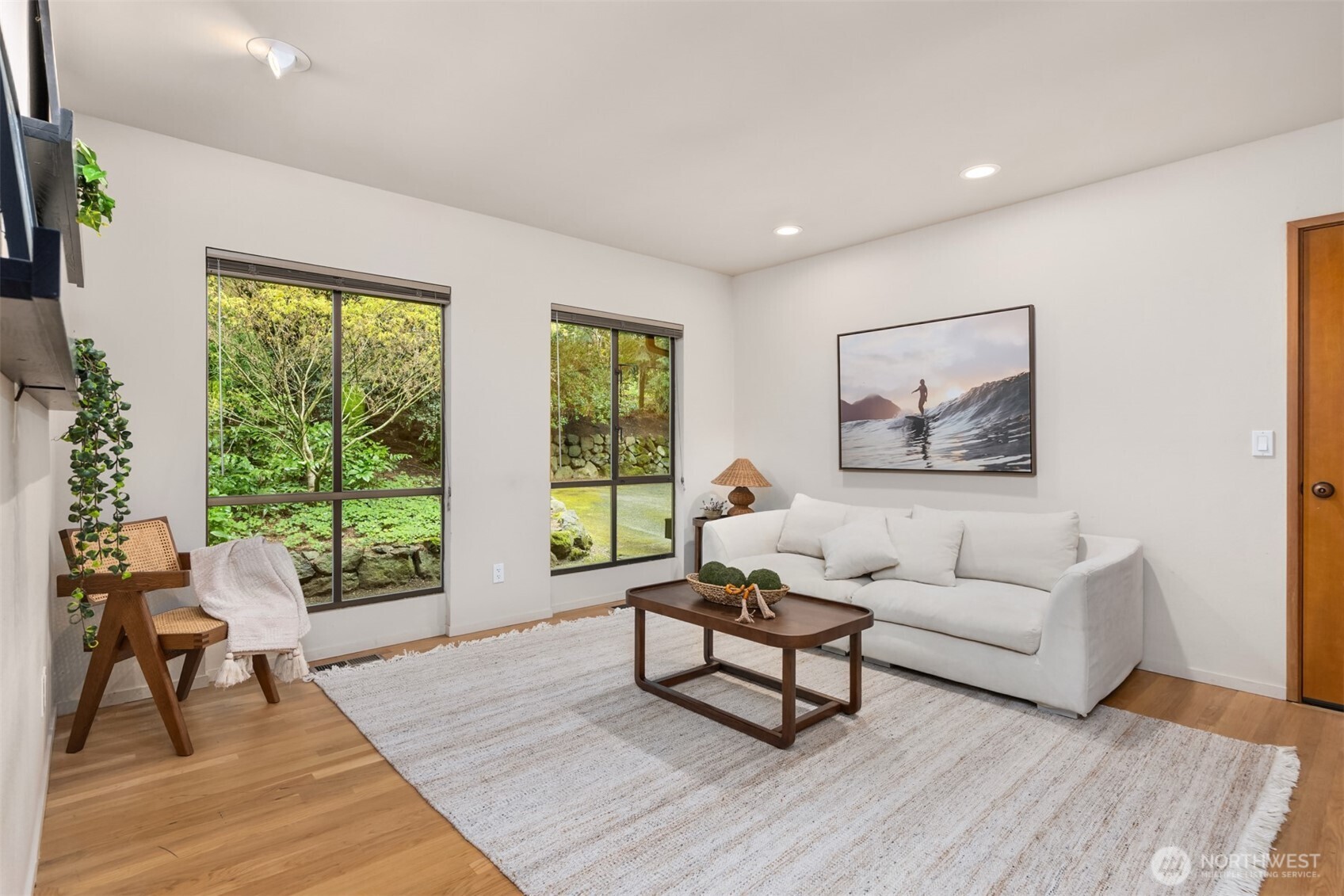 8151 Northeast Hidden Cove Road Bainbridge Island, WA 98110 - Photo 15 of 40 a living room with furniture and a large window