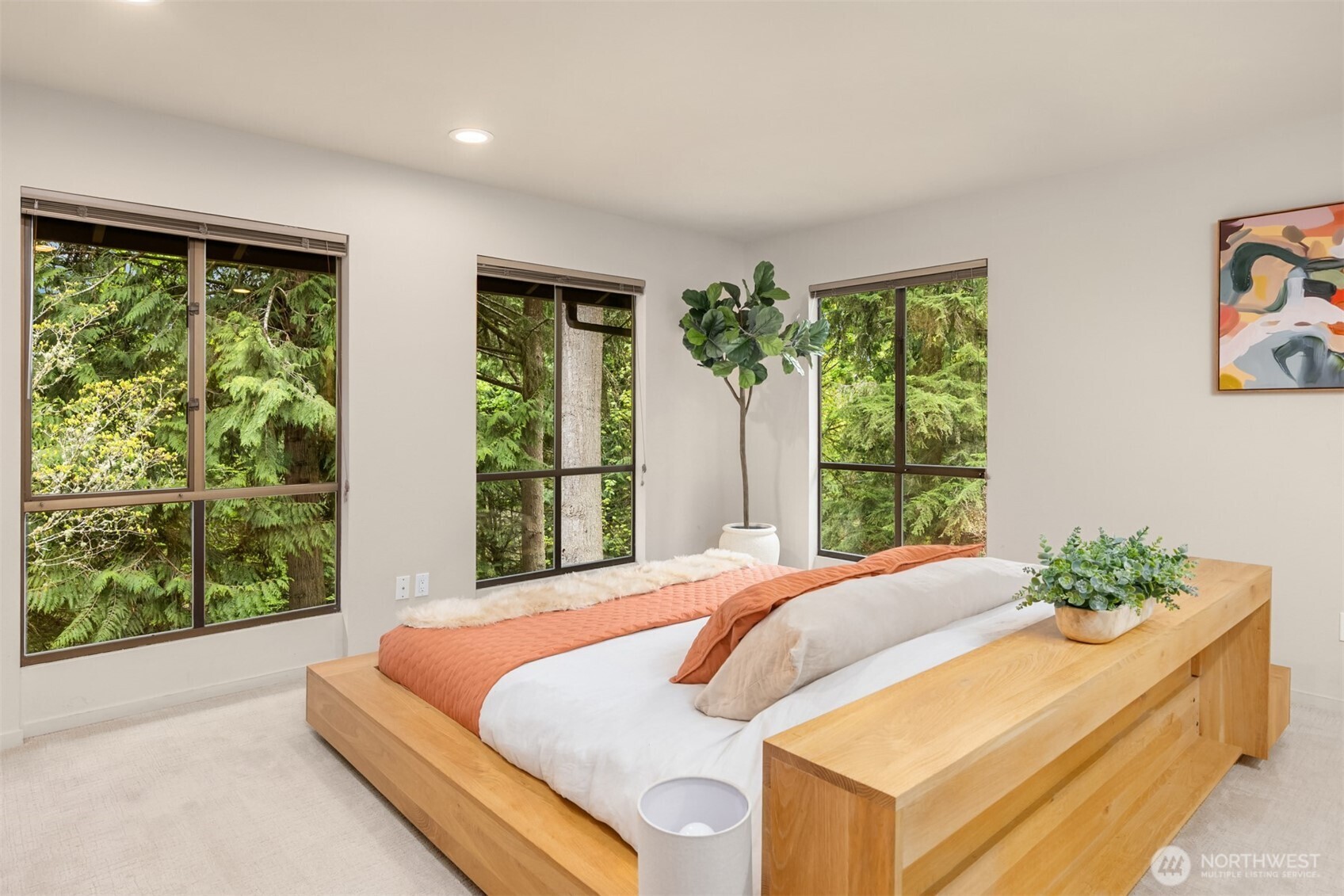 8151 Northeast Hidden Cove Road Bainbridge Island, WA 98110 - Photo 18 of 40 a bedroom with a bed and a window