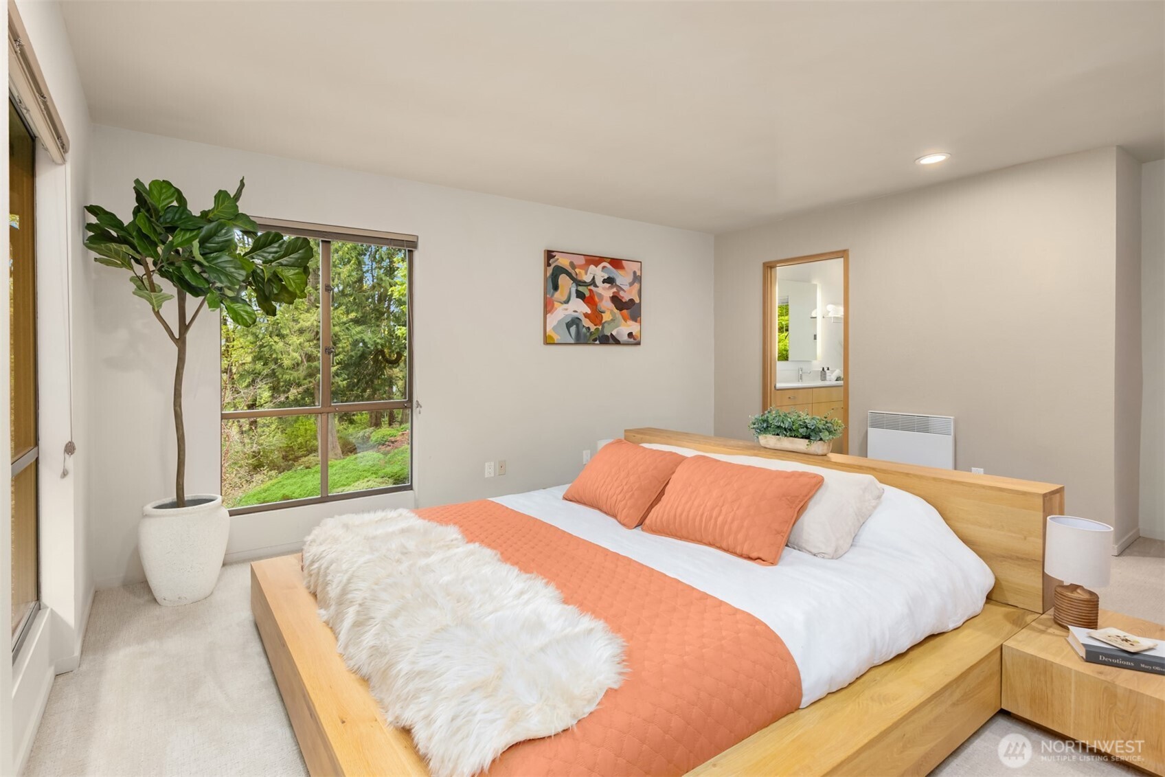 8151 Northeast Hidden Cove Road Bainbridge Island, WA 98110 - Photo 19 of 40 a bedroom with a bed and a window