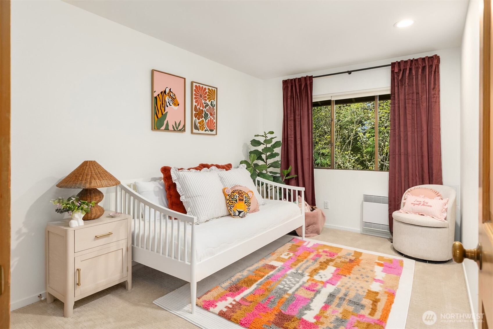 8151 Northeast Hidden Cove Road Bainbridge Island, WA 98110 - Photo 23 of 40 a bedroom with furniture and a window