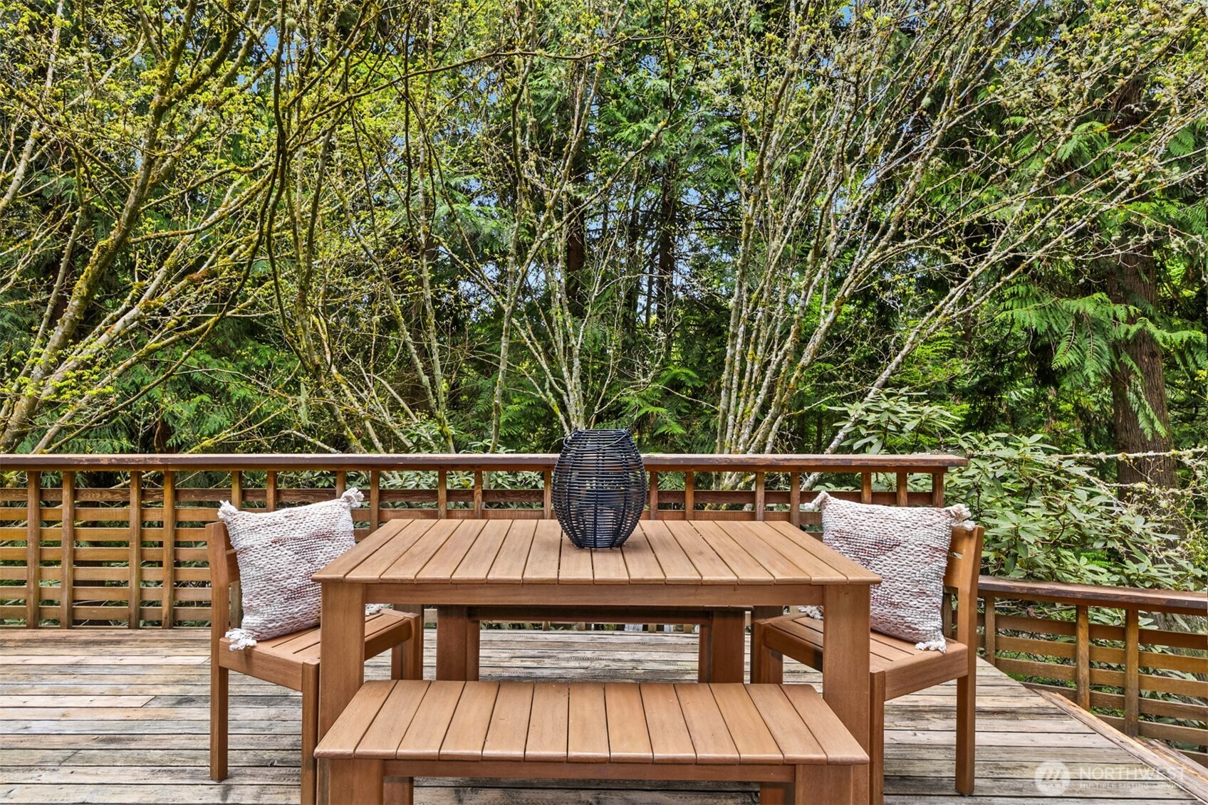 8151 Northeast Hidden Cove Road Bainbridge Island, WA 98110 - Photo 29 of 40 a view of a chairs and table on the deck