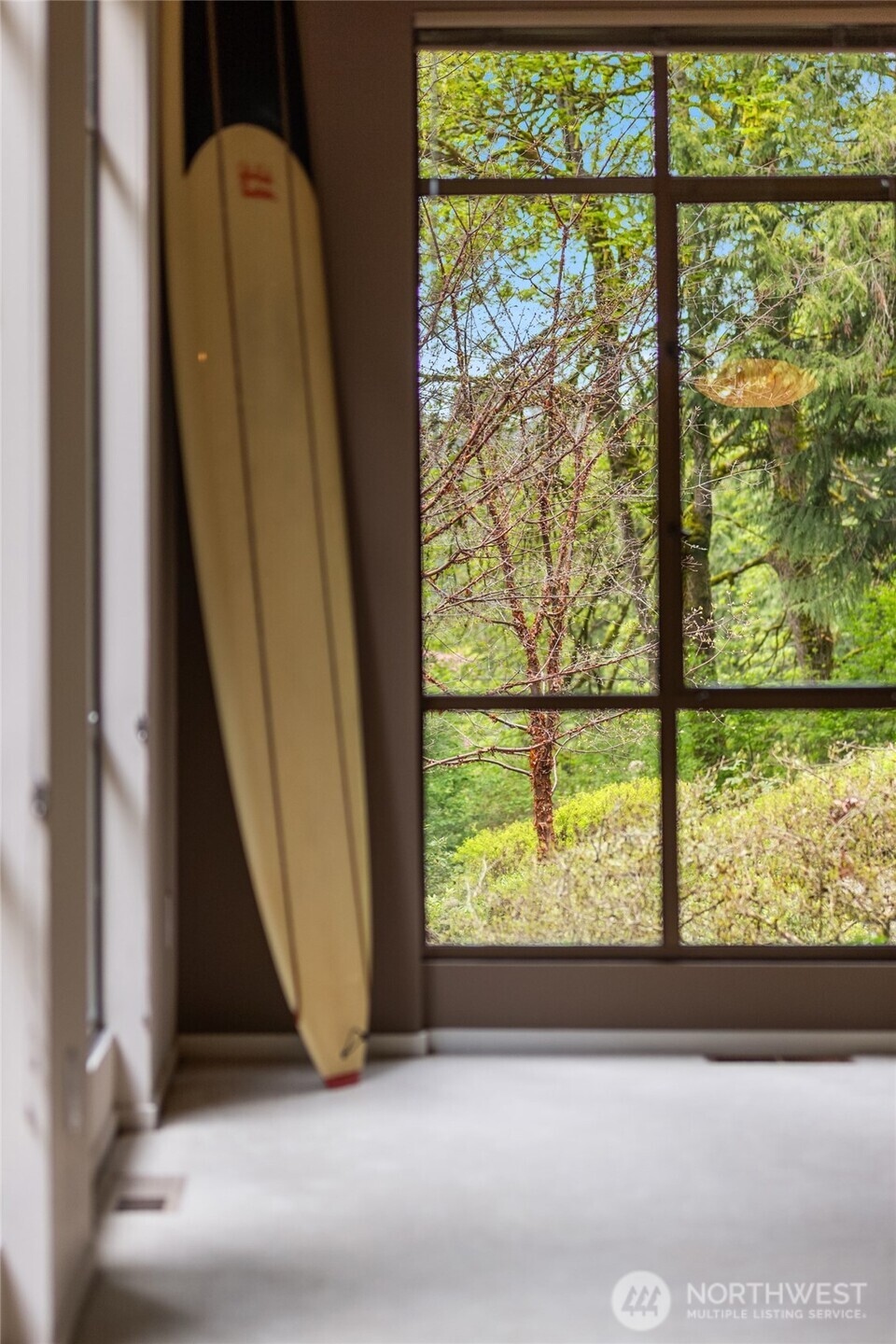 8151 Northeast Hidden Cove Road Bainbridge Island, WA 98110 - Photo 6 of 40 a view of a room with a large window