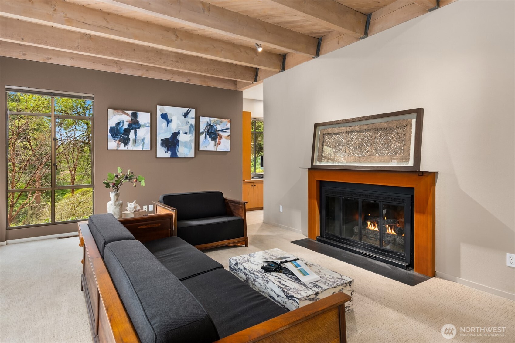 8151 Northeast Hidden Cove Road Bainbridge Island, WA 98110 - Photo 7 of 40 a living room with furniture and a fireplace