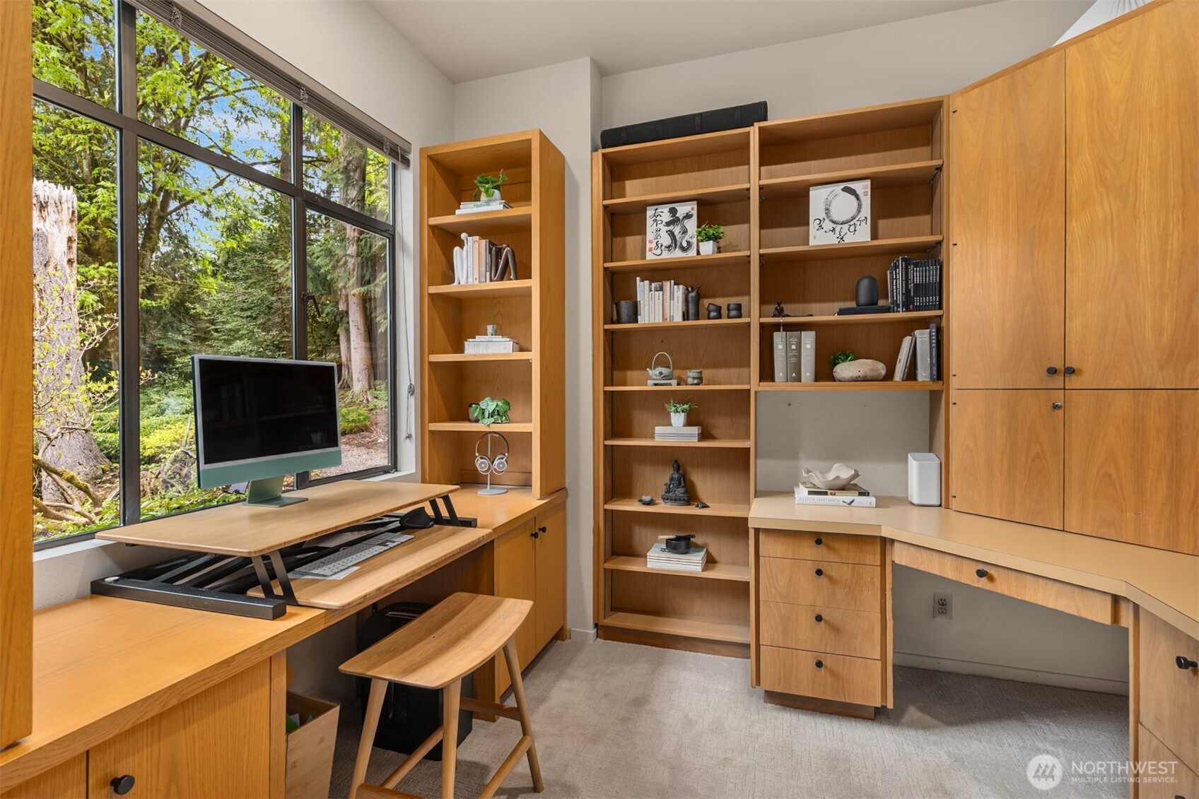 8151 Northeast Hidden Cove Road Bainbridge Island, WA 98110 - Photo 9 of 40 a bedroom with a bed and a flat tv screen