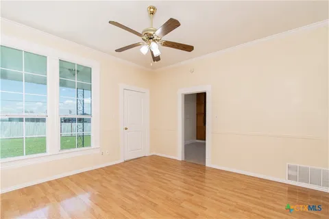 a view of an empty room with a window