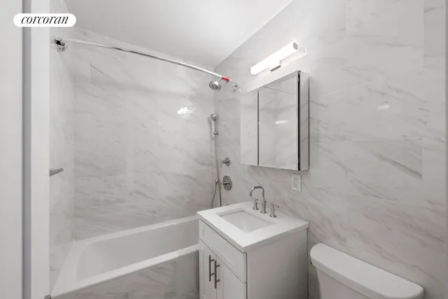 a bathroom with a sink vanity and mirror