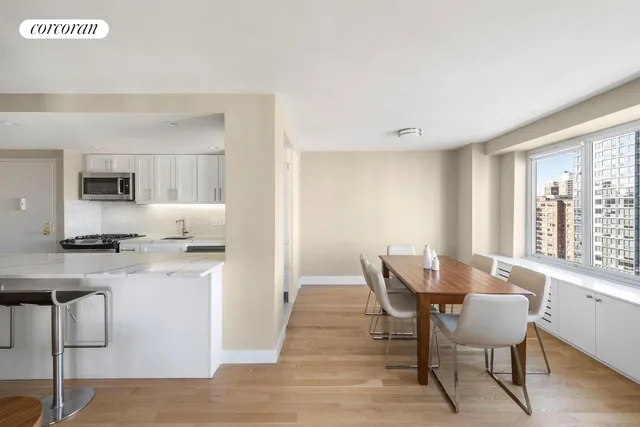a kitchen with granite countertop a stove a sink and a refrigerator