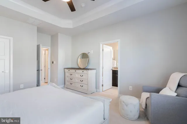 a bathroom with a granite countertop sink toilet and a mirror