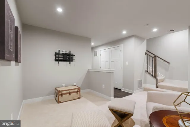 an aerial view of a house with a garden and lake view