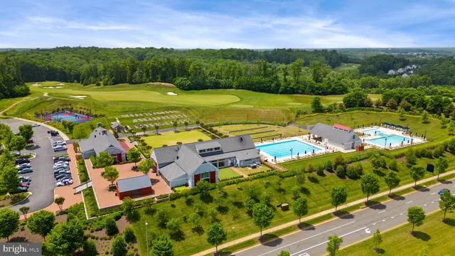 a view of a lake with furniture and city view