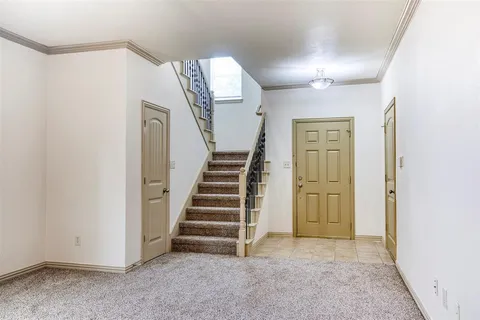 a view of entryway with stairs