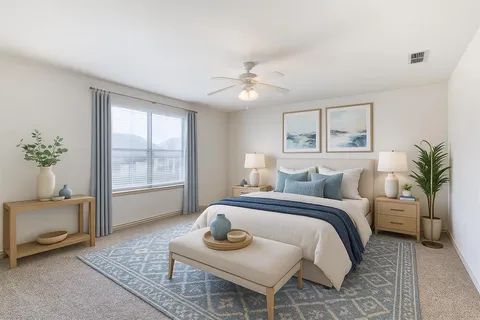 a bedroom with a bed and glass window