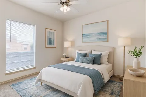 a bedroom with bed and window