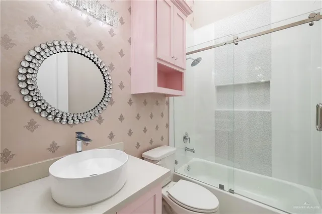 a bathroom with a sink a toilet and a bathtub