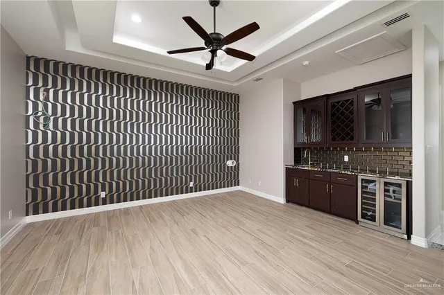 a view of a bathroom with a granite countertop sink and a mirror
