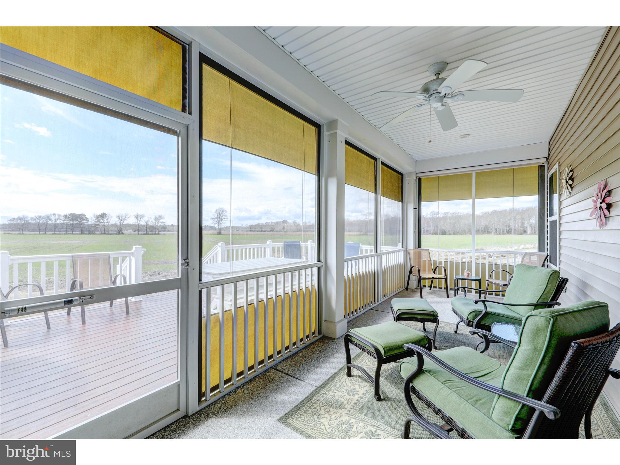 28404 Reef Drive Selbyville, DE 19975 - Photo 51 of 52 Sunroom on back deck with sliding screens
