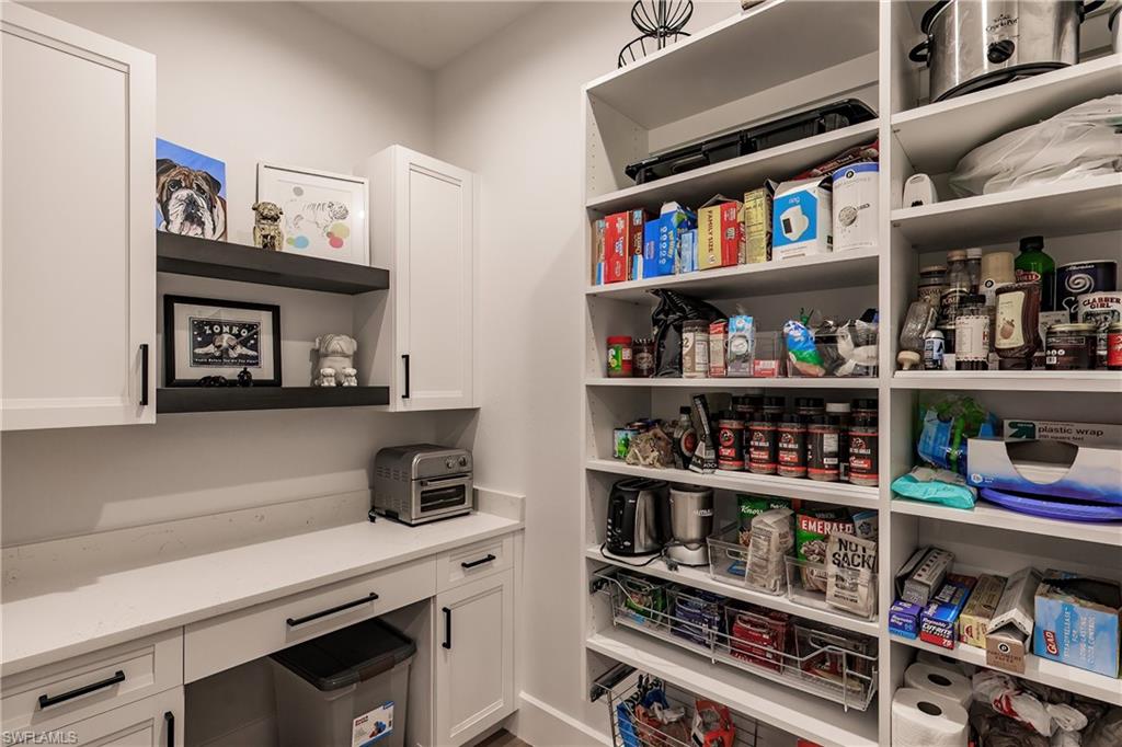 20199 Markward Crossing Estero, FL 33928 - Photo 11 of 45 a view of a kitchen with fridge and rack