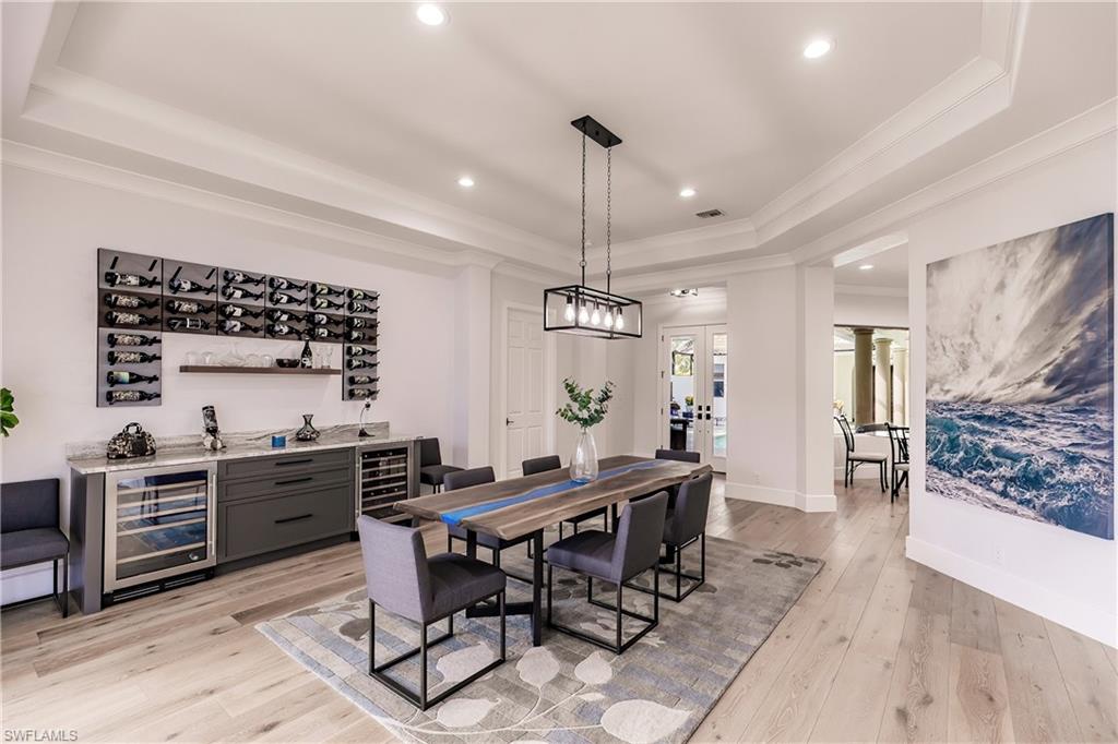 20199 Markward Crossing Estero, FL 33928 - Photo 13 of 45 a kitchen with a table and chairs in it
