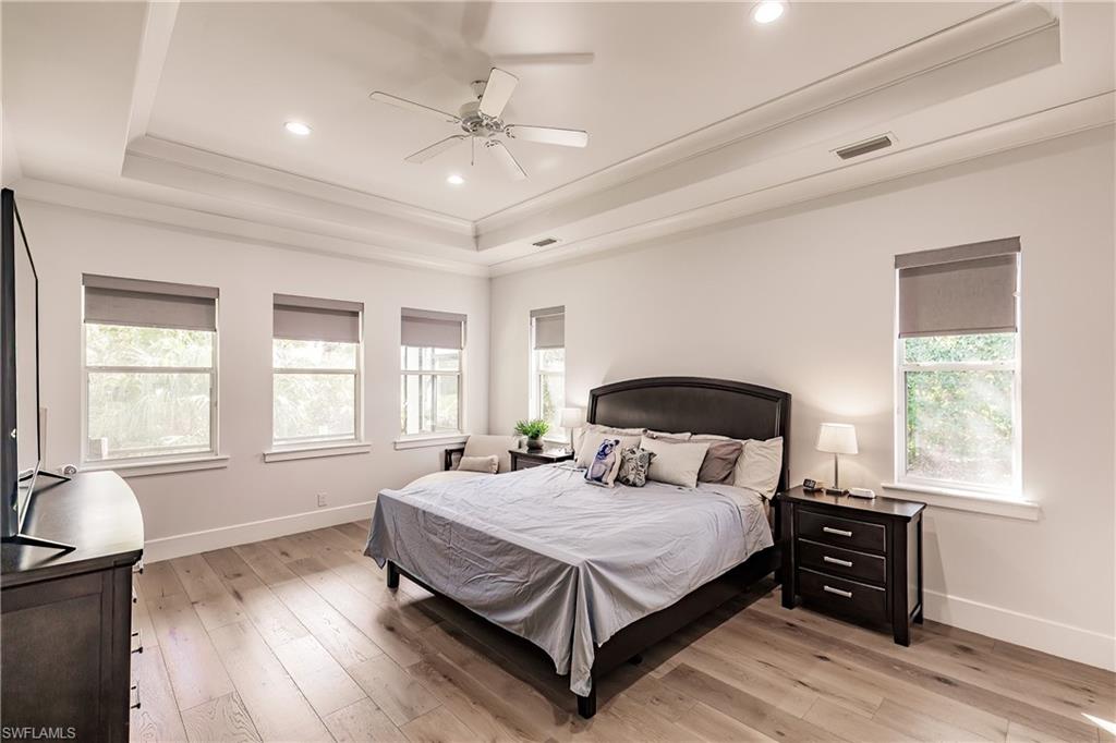 20199 Markward Crossing Estero, FL 33928 - Photo 14 of 45 a bedroom with a large bed and a window