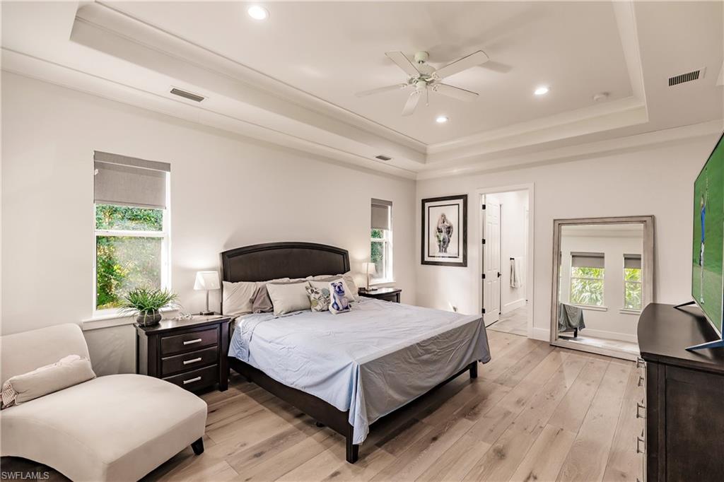 20199 Markward Crossing Estero, FL 33928 - Photo 15 of 45 a bedroom with a bed and wooden floor