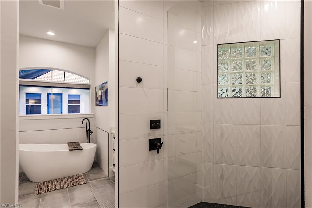 20199 Markward Crossing Estero, FL 33928 - Photo 17 of 45 a bathroom with a toilet sink and shower