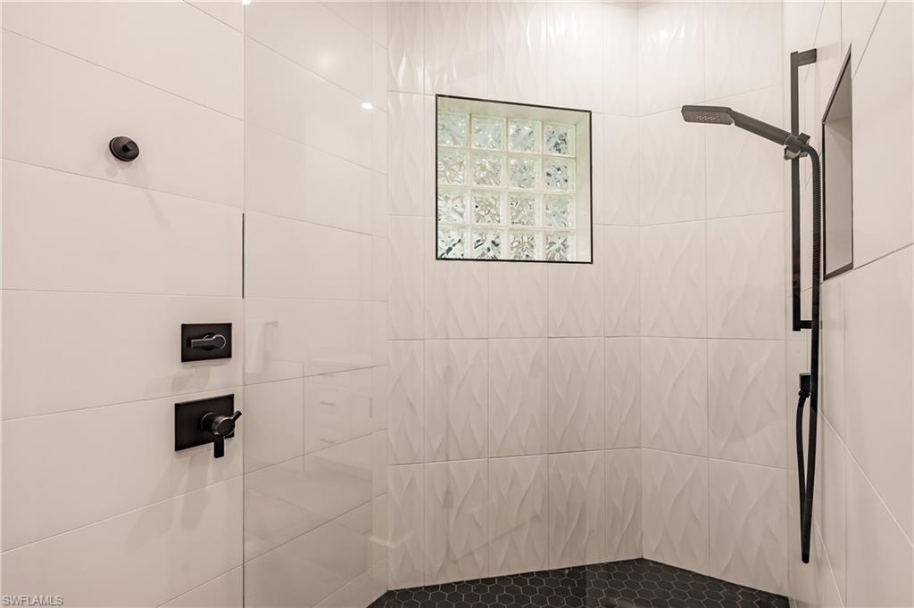 20199 Markward Crossing Estero, FL 33928 - Photo 18 of 45 a bathroom with a shower