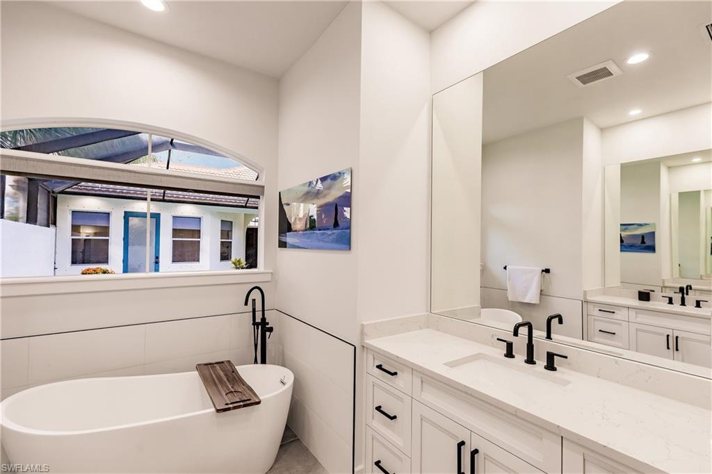 20199 Markward Crossing Estero, FL 33928 - Photo 19 of 45 a bathroom with a sink and a mirror