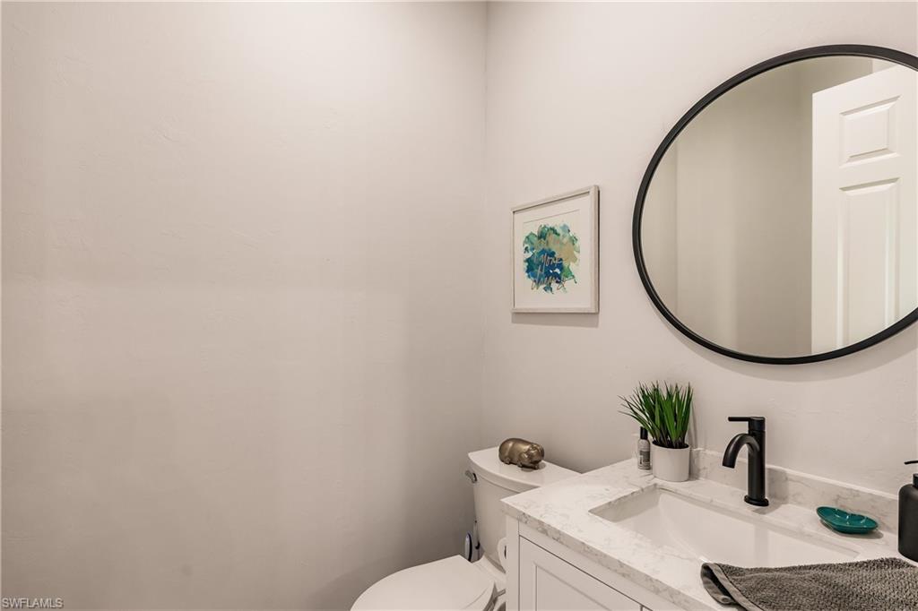 20199 Markward Crossing Estero, FL 33928 - Photo 23 of 45 a bathroom with a sink and a mirror