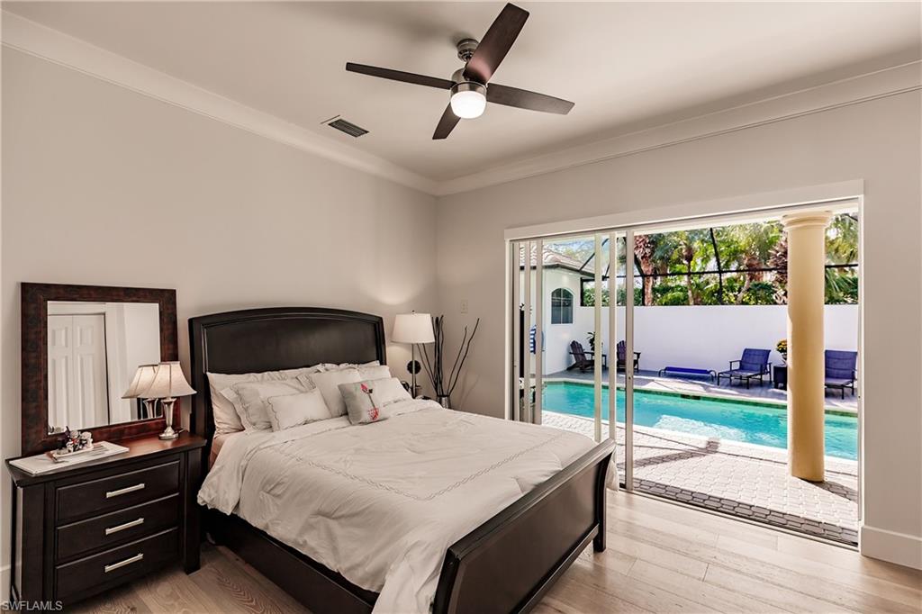 20199 Markward Crossing Estero, FL 33928 - Photo 24 of 45 a bedroom with a bed and a large window