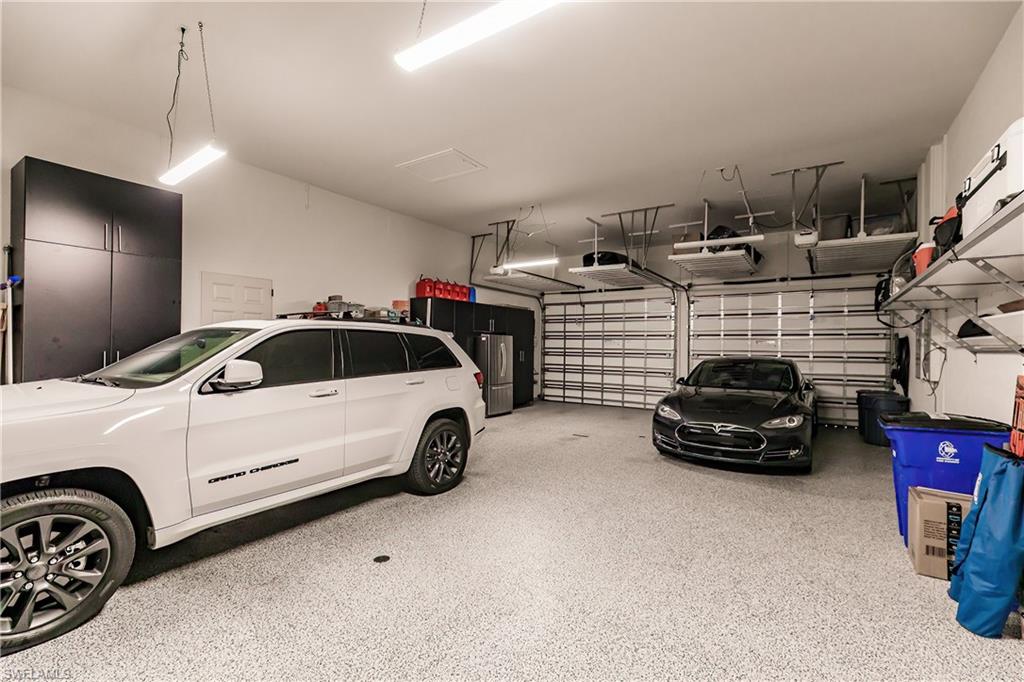 20199 Markward Crossing Estero, FL 33928 - Photo 28 of 45 a car parked in garage