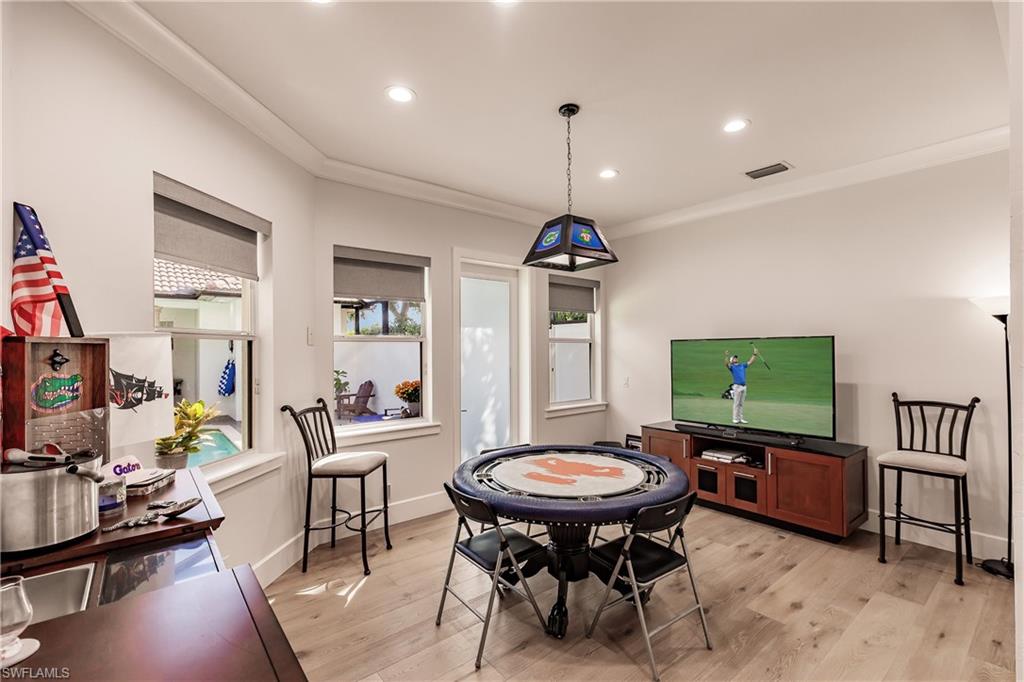 20199 Markward Crossing Estero, FL 33928 - Photo 30 of 45 a room with furniture and a flat screen tv
