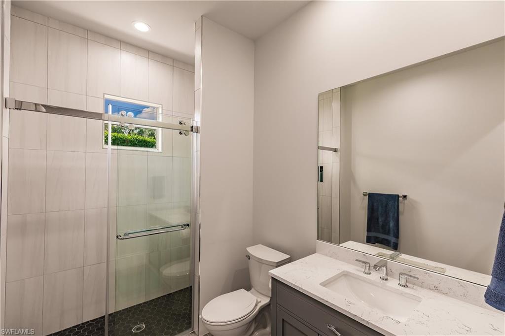 20199 Markward Crossing Estero, FL 33928 - Photo 32 of 45 a bathroom with a sink a toilet and shower