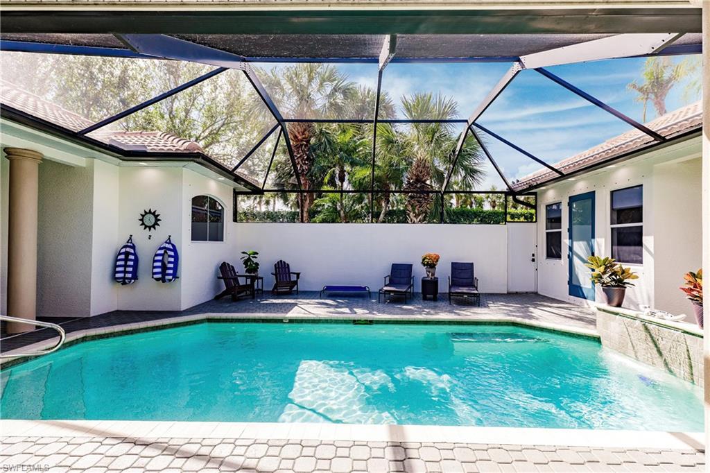 20199 Markward Crossing Estero, FL 33928 - Photo 34 of 45 a front view of a house with garden