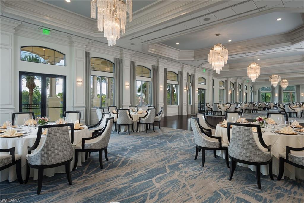 20199 Markward Crossing Estero, FL 33928 - Photo 42 of 45 a dining room with furniture a chandelier and wooden floor